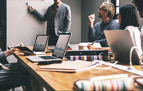 business meeting with presentation and computer on desk background